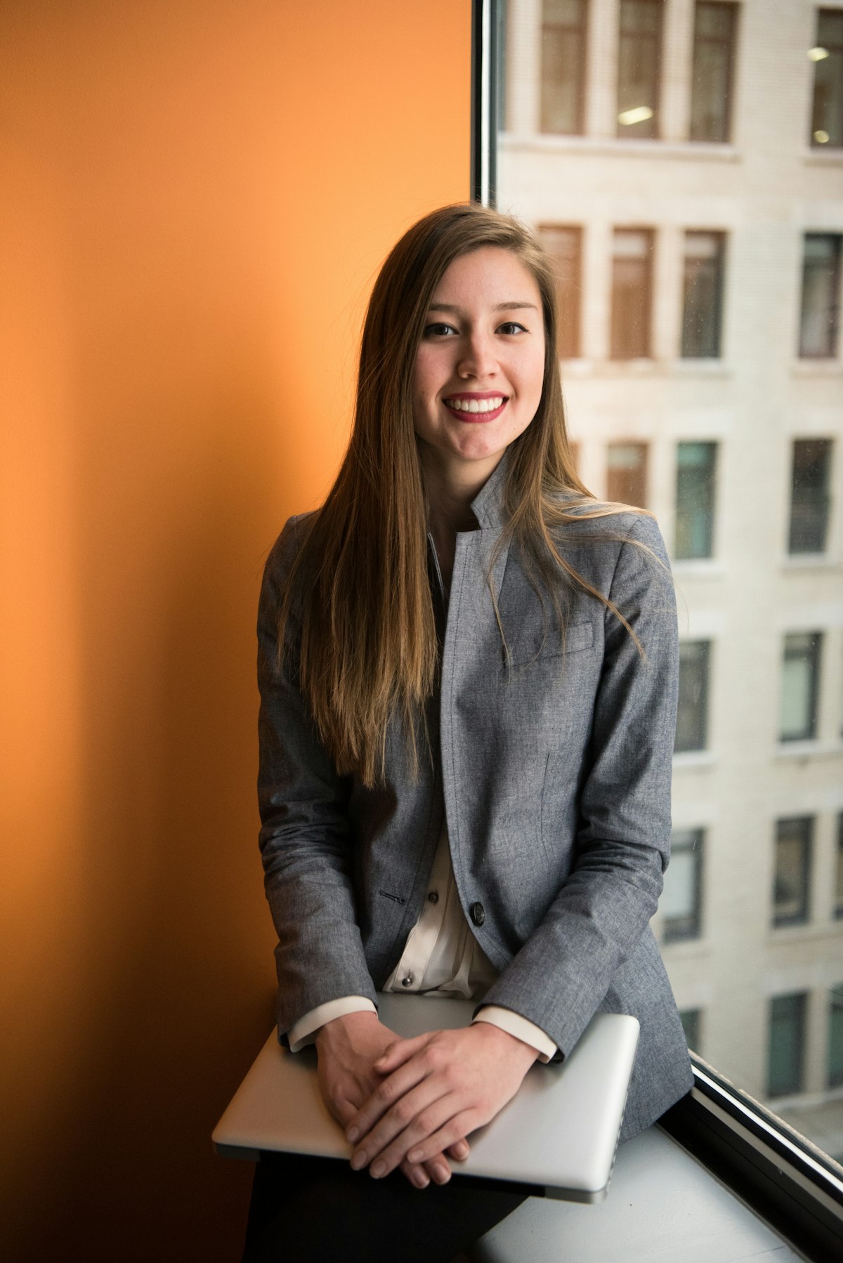 Professional certified interpreter wearing headset in high-stakes conference setting